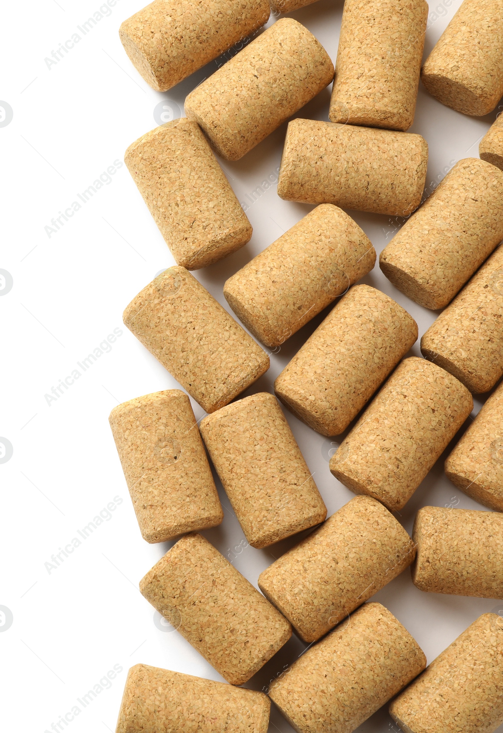 Photo of Wine bottle corks on white background, top view