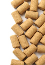 Photo of Wine bottle corks on white background, top view