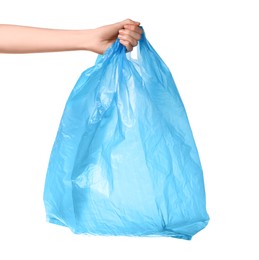 Photo of Woman holding light blue plastic bag on white background, closeup