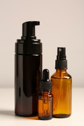 Bottles with oil on white table. Natural cosmetics