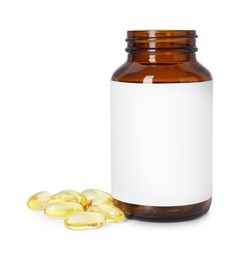 Photo of Bottle and pile of softgel capsules isolated on white