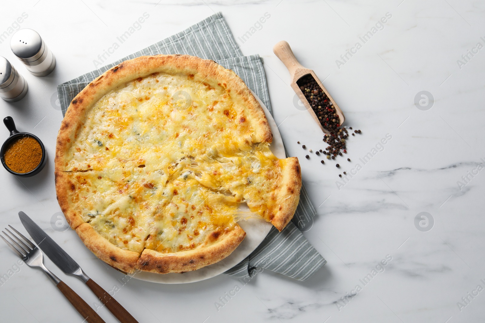 Photo of Delicious cheese pizza served on white marble table, flat lay. Space for text