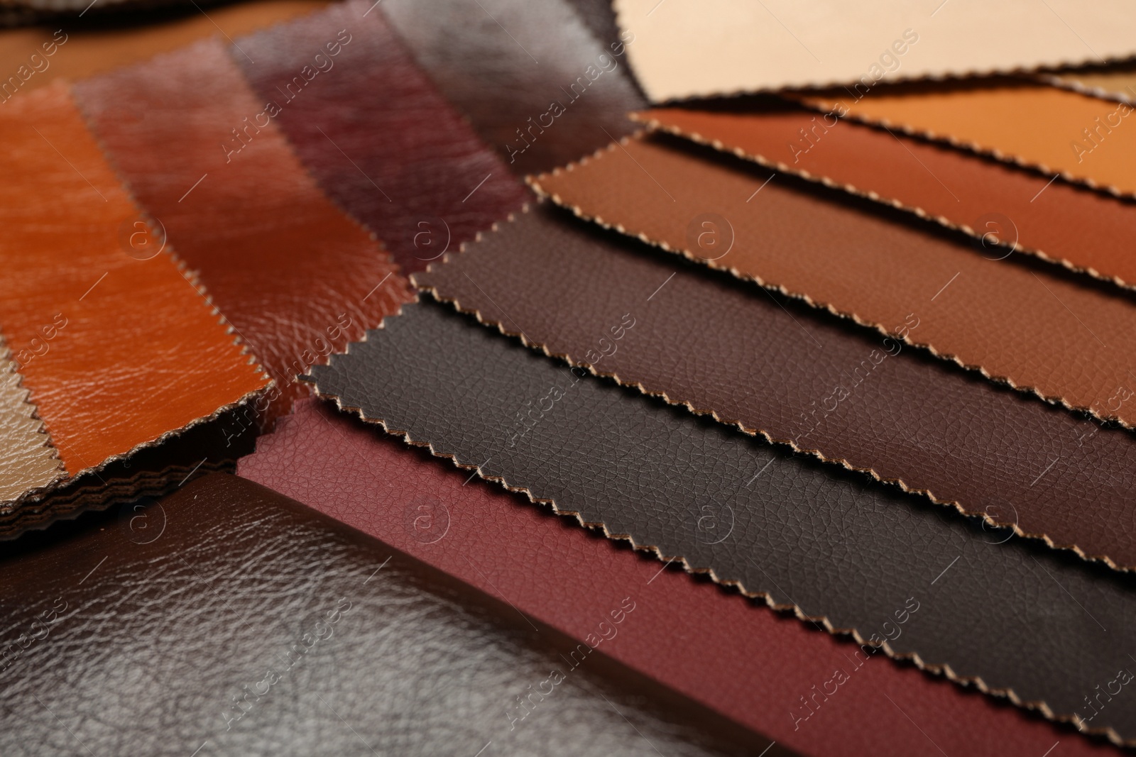 Photo of Different leather samples as background, closeup view