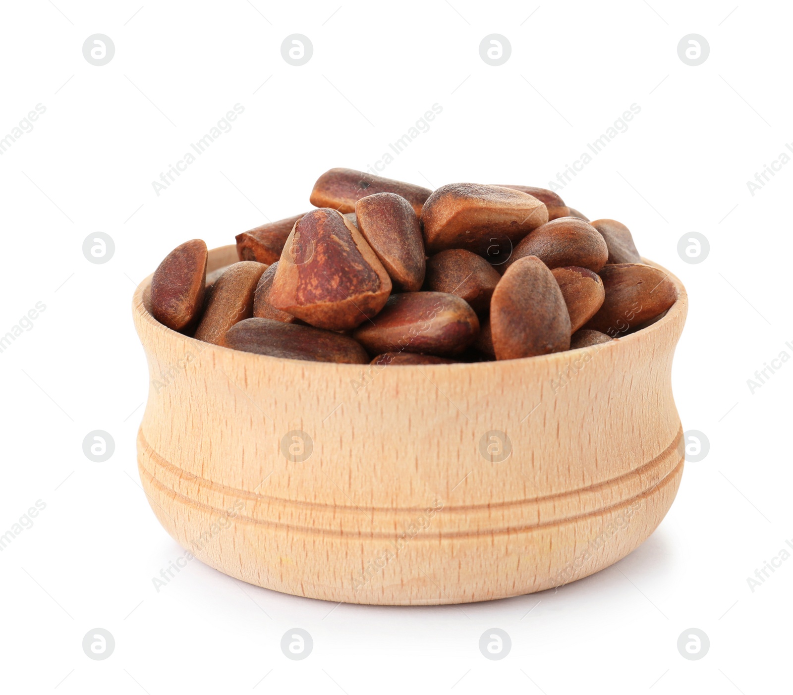 Photo of Bowl with pine nuts on white background