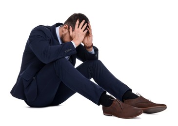 Photo of Upset bearded businessman in suit on white background