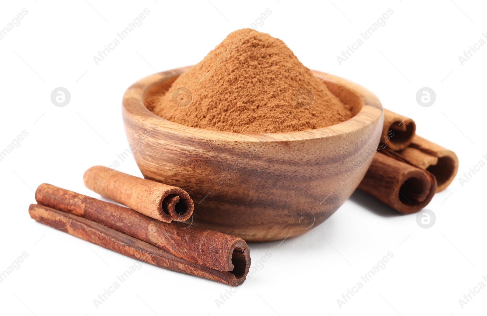 Photo of Dry aromatic cinnamon sticks and powder isolated on white