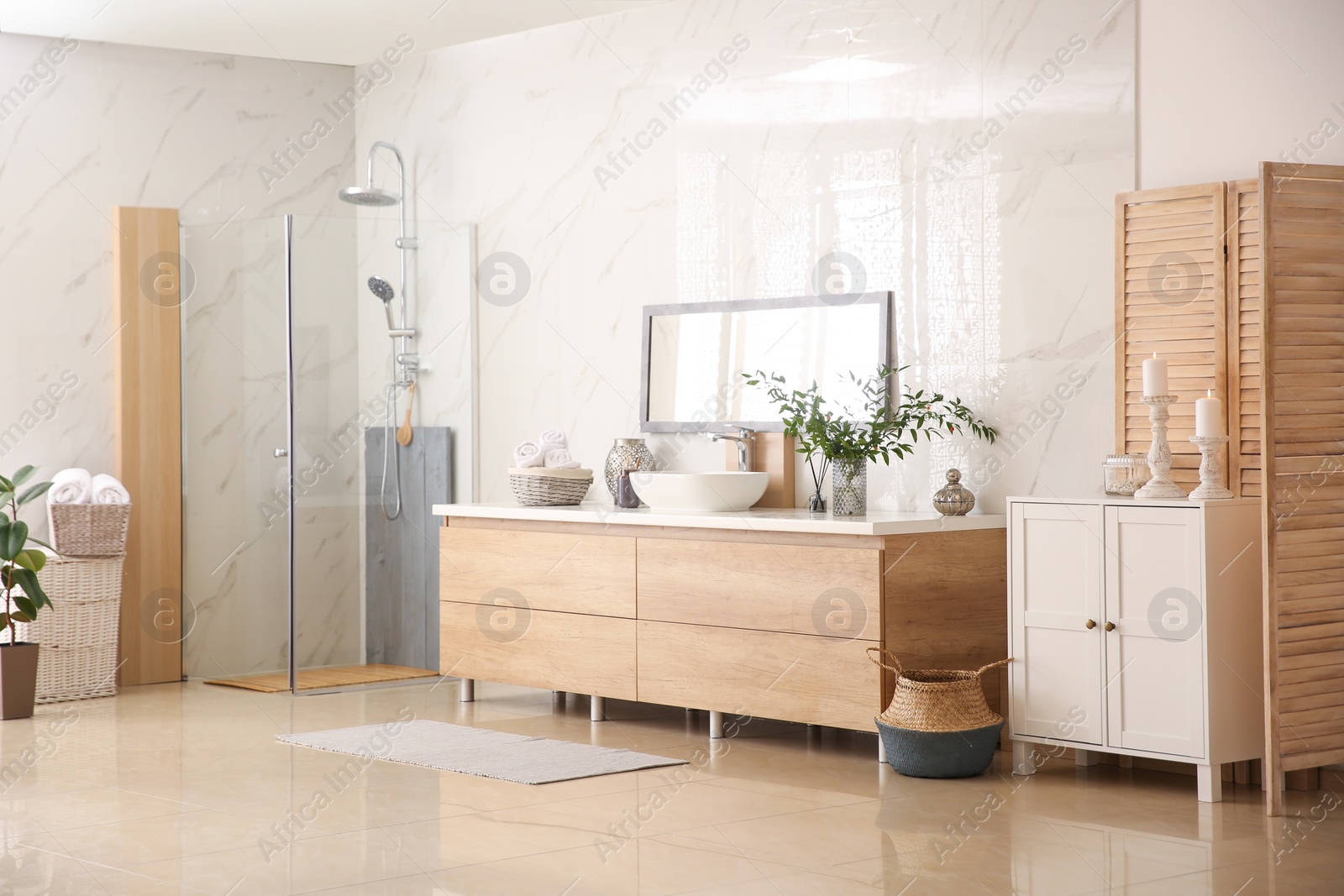 Photo of Modern bathroom interior with stylish mirror and vessel sink