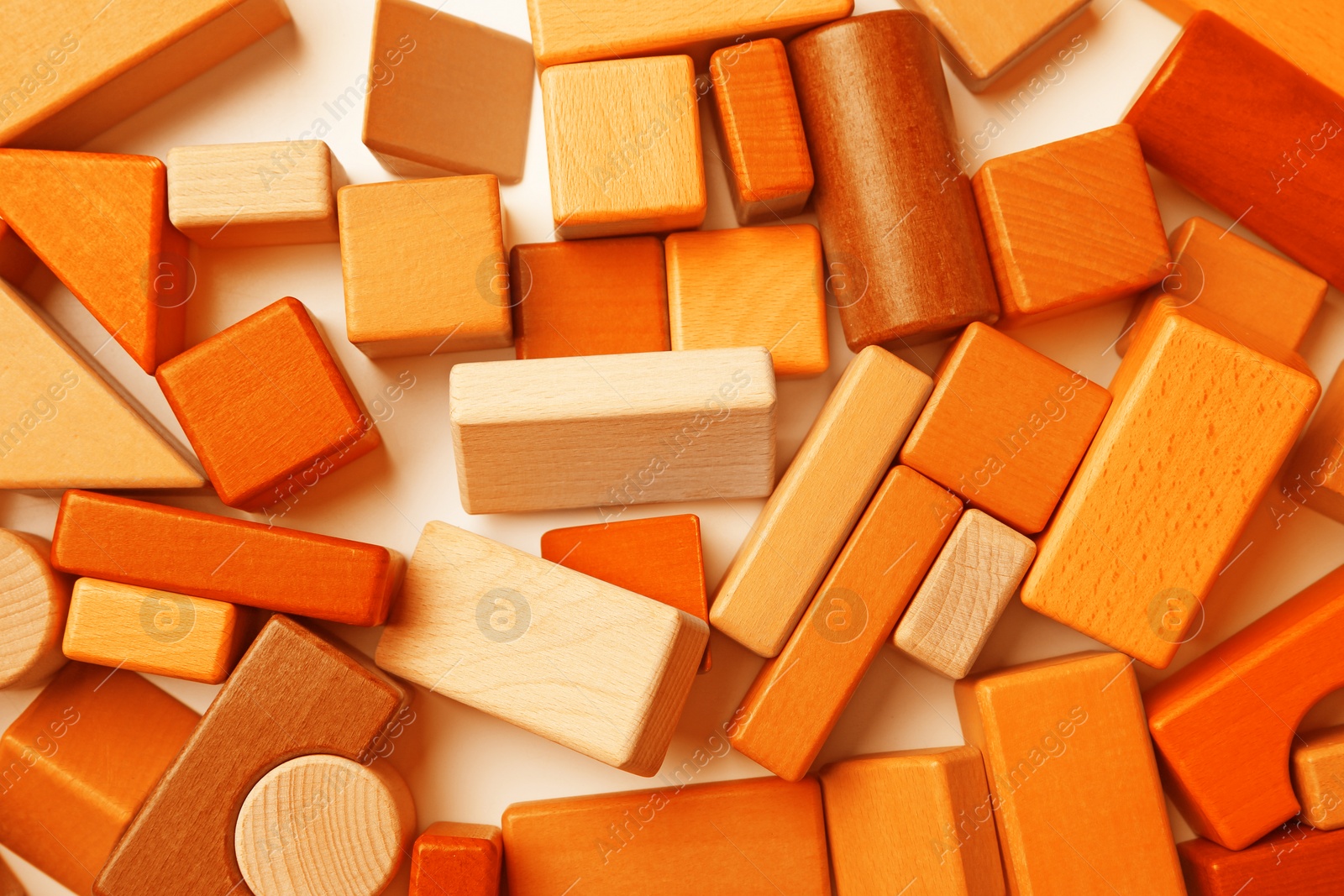 Image of Orange wooden construction set on white background, top view