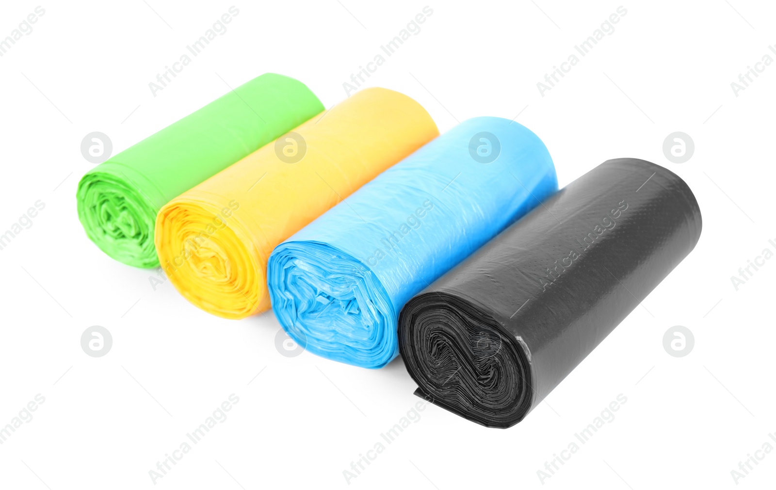 Photo of Rolls of colorful garbage bags isolated on white