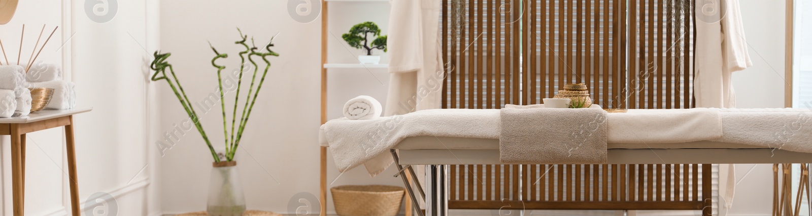 Image of Spa cabinet interior with massage table in wellness center. Banner design