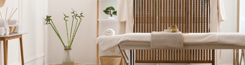 Image of Spa cabinet interior with massage table in wellness center. Banner design