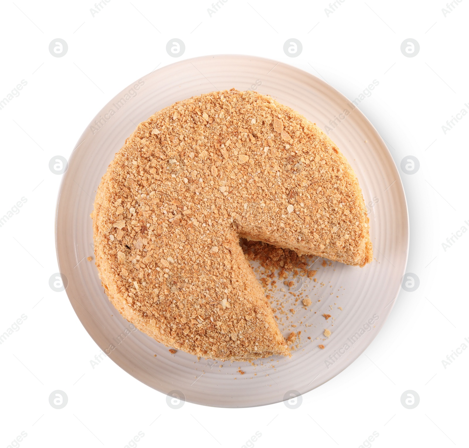 Photo of Delicious cut Napoleon cake isolated on white, top view