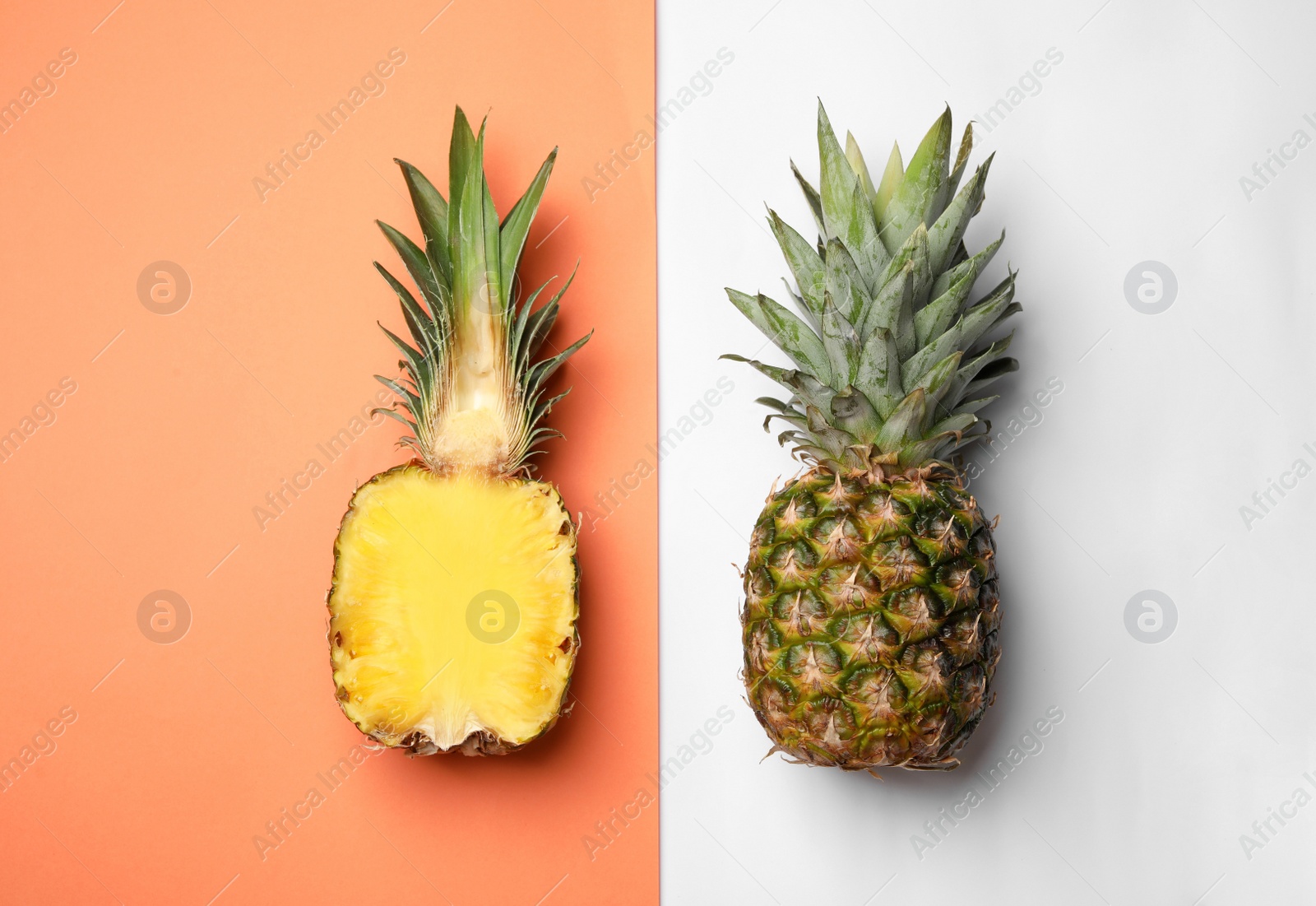 Photo of Flat lay composition with cut and fresh juicy pineapples on color background