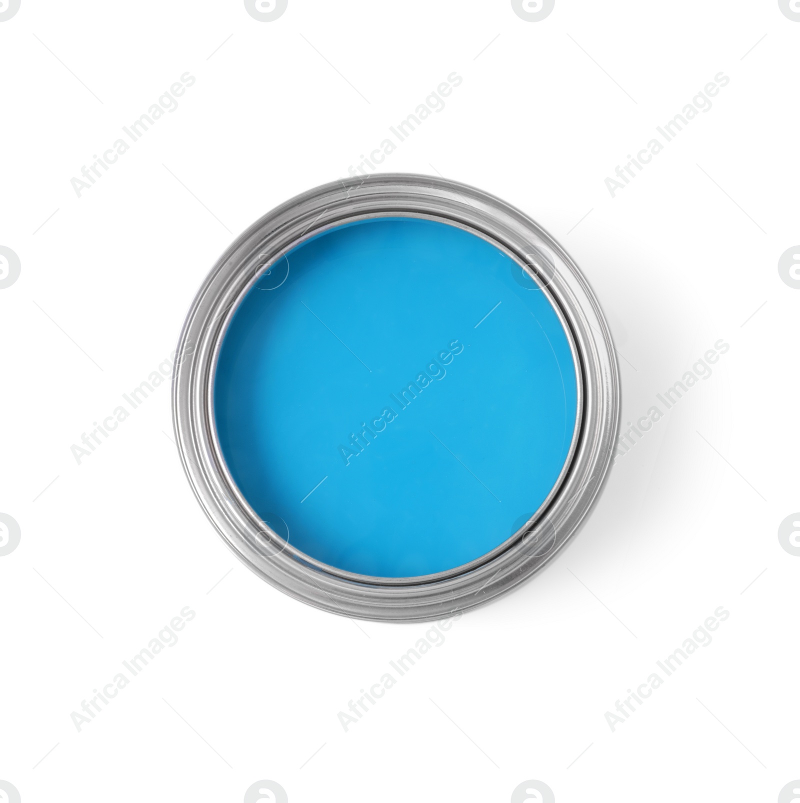 Photo of Can with light blue paint on white background, top view