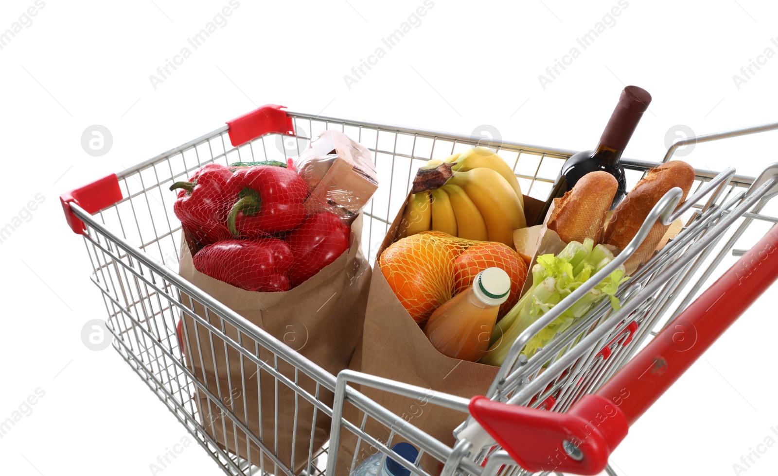 Photo of Shopping cart full of groceries on white background