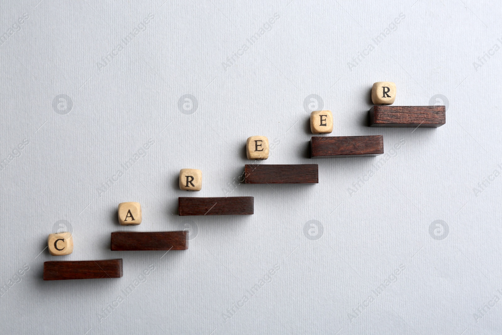 Photo of Wooden beads with word CAREER on steps, flat lay. Business promotion