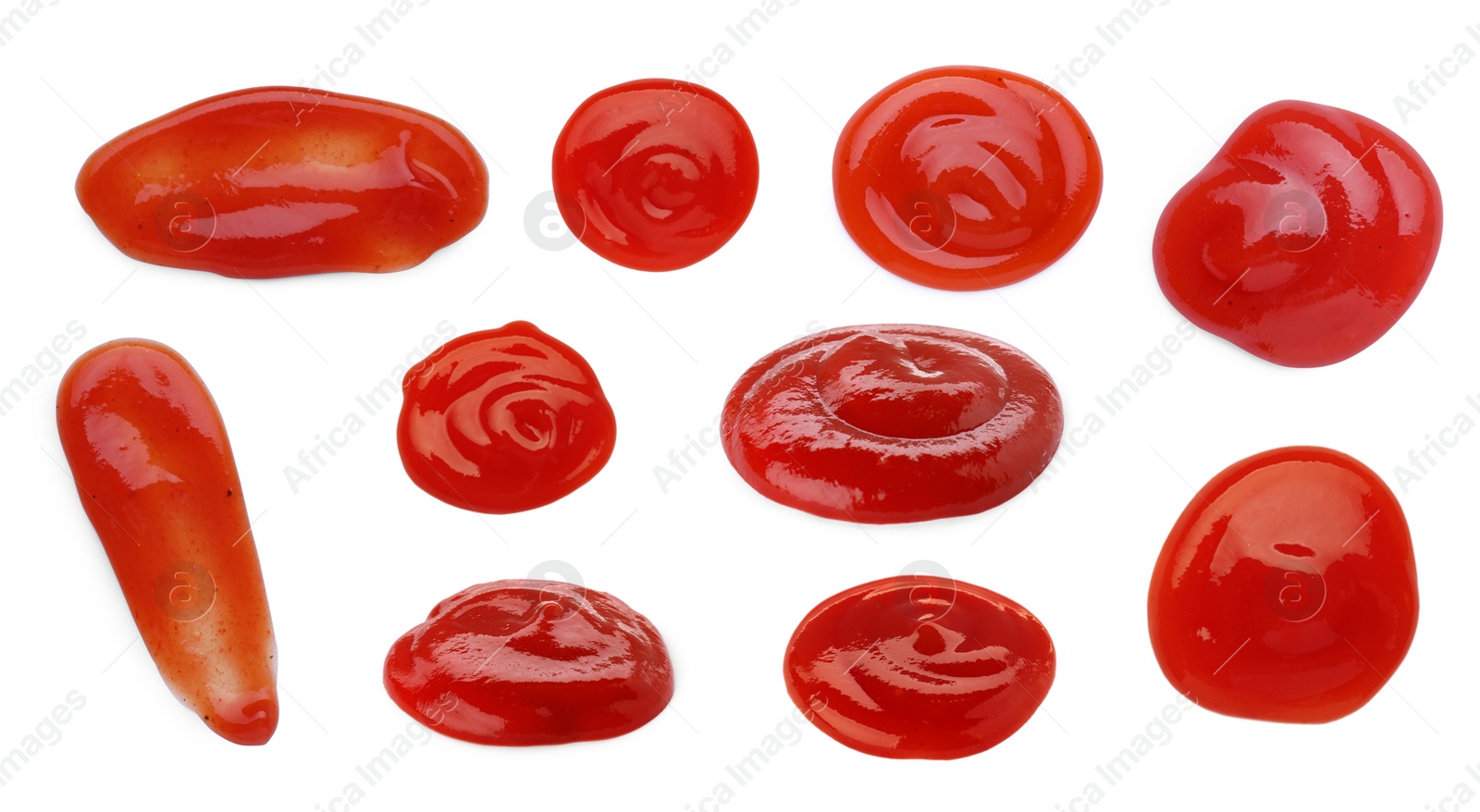 Image of Set of different ketchup smears on white background