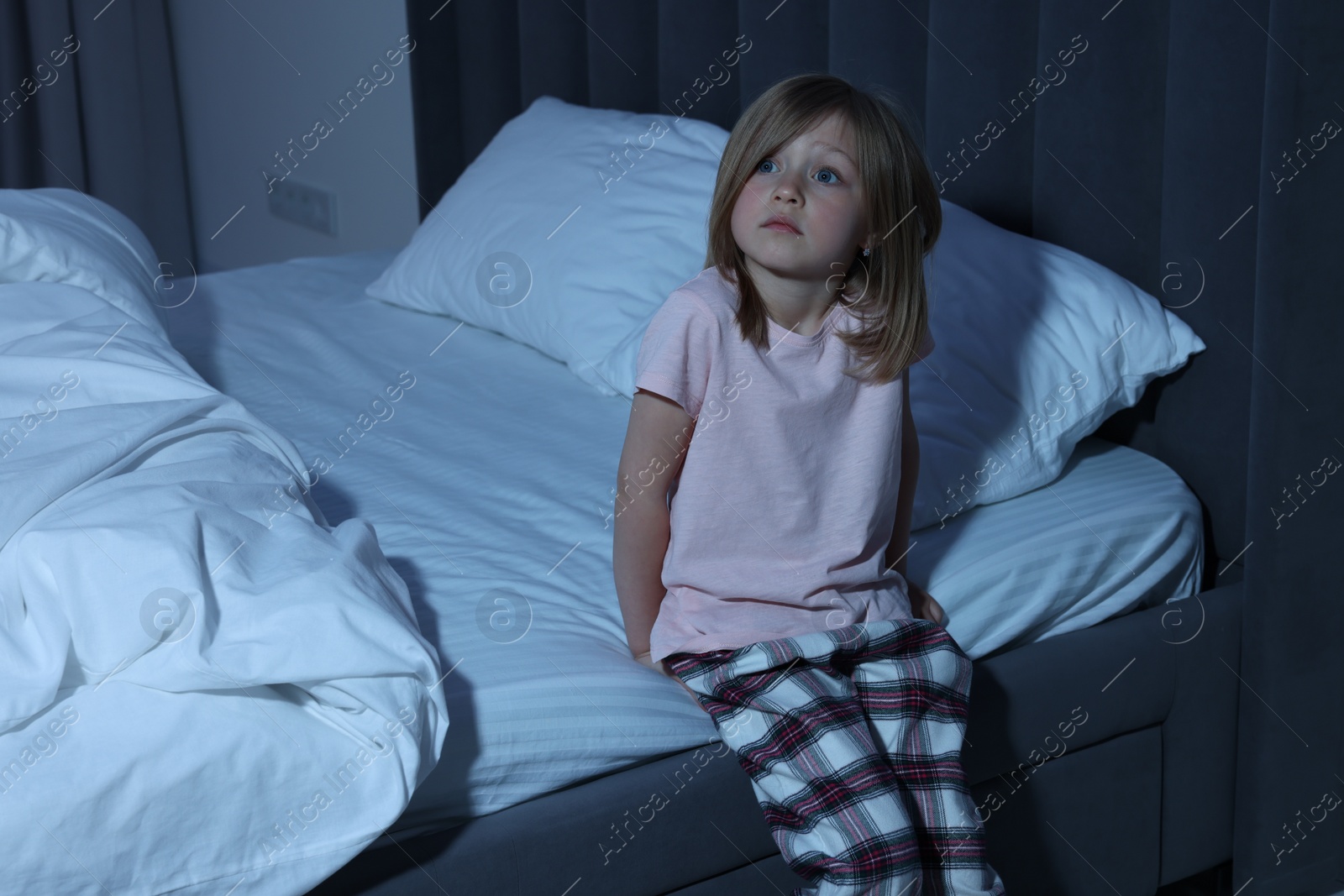 Photo of Portrait of little sleepy girl in bedroom, space for text