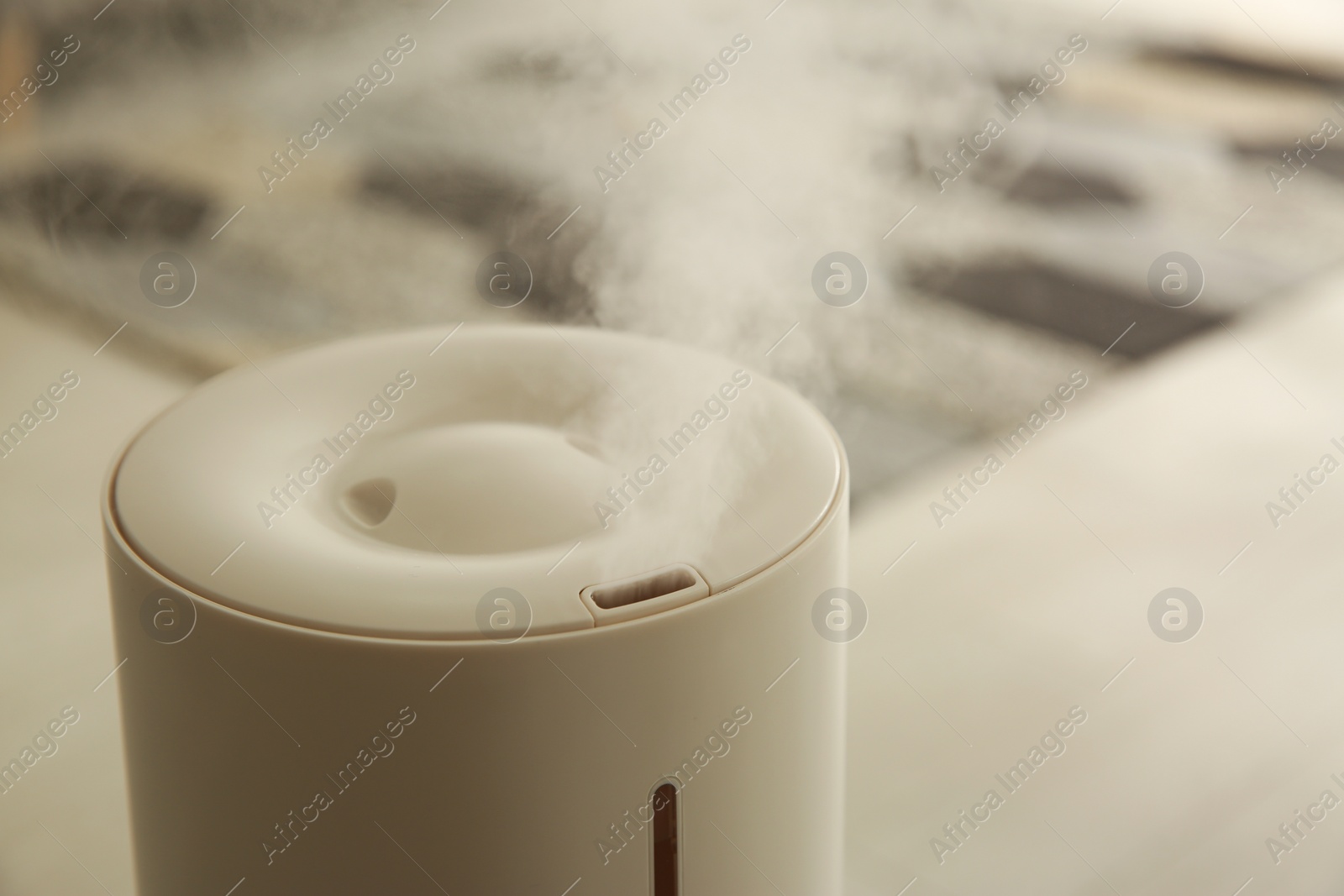 Photo of Modern humidifier indoors, closeup view. Home appliance