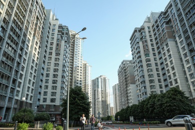 Photo of KYIV, UKRAINE - MAY 21, 2019: Beautiful view of modern housing estate in Pecherskyi district on sunny day, low angle