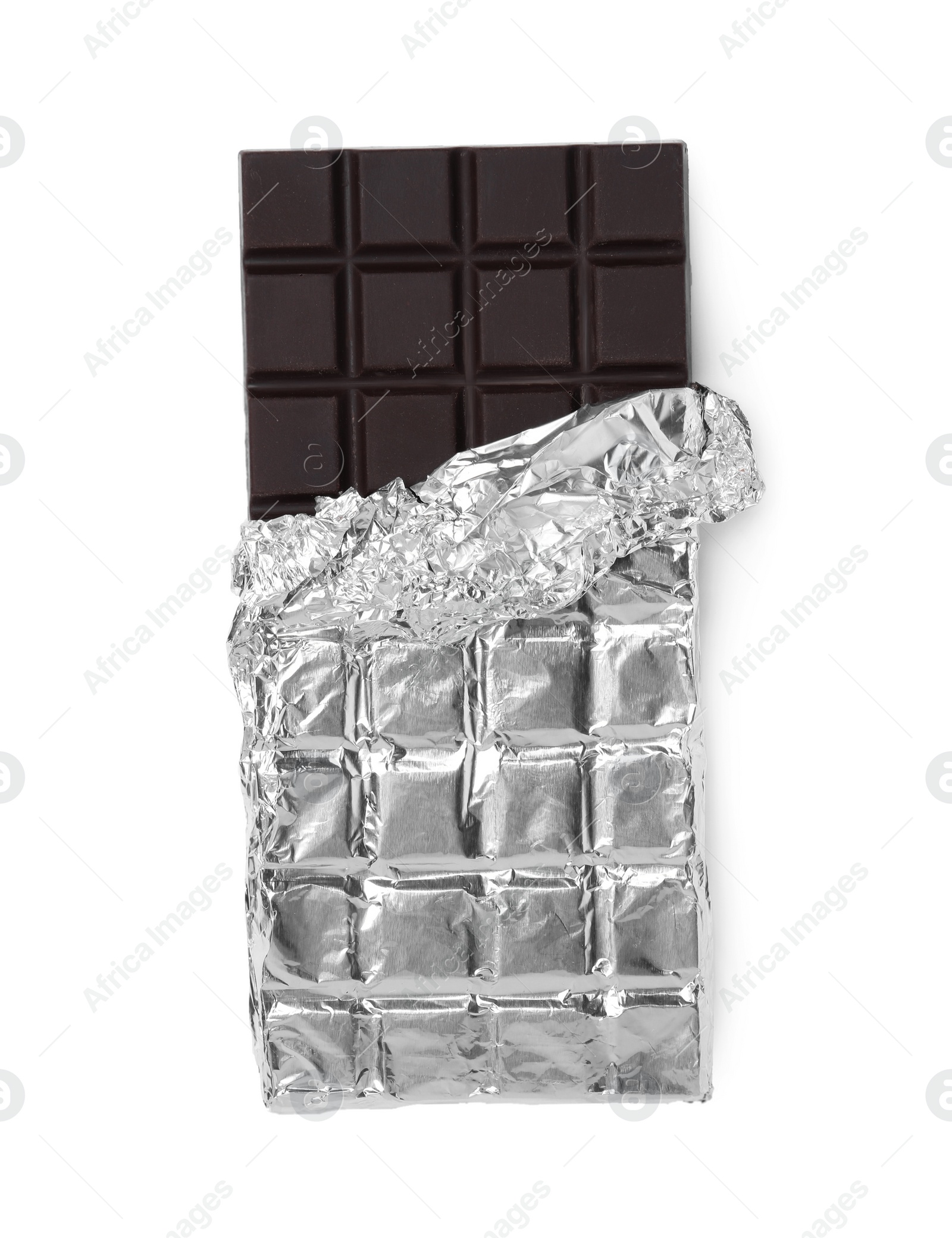 Photo of Delicious dark chocolate bar wrapped in foil isolated on white, top view