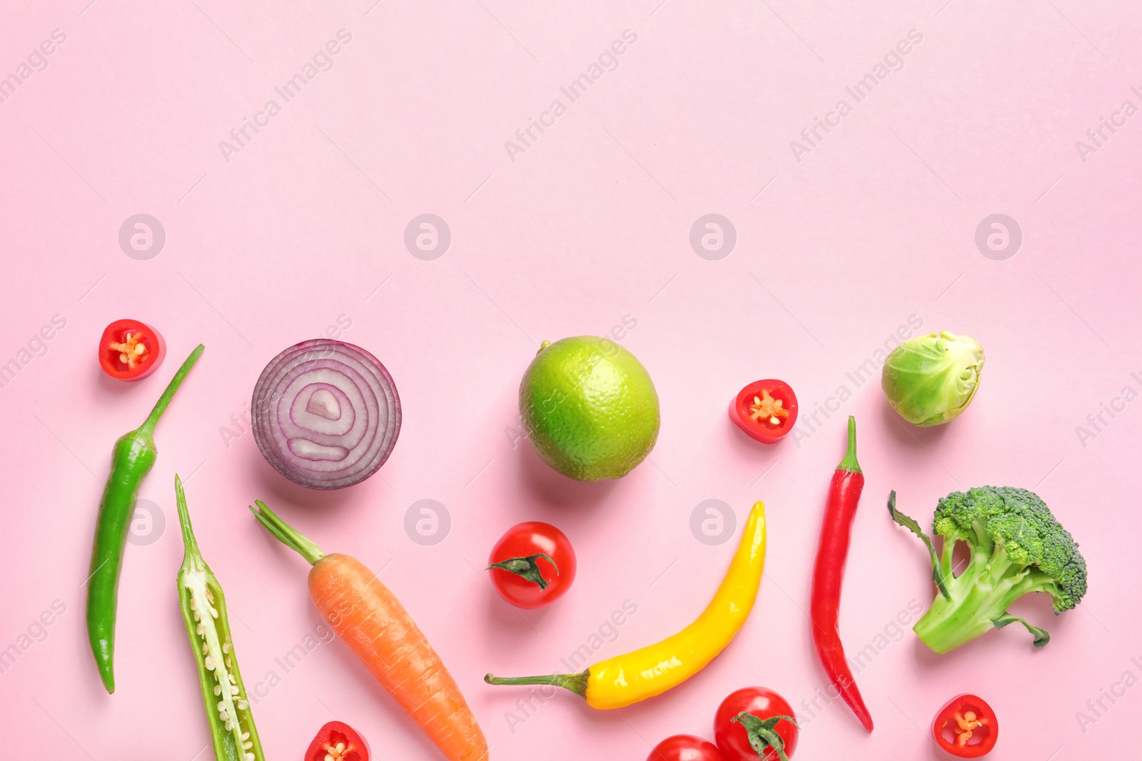 Photo of Flat lay composition with fresh vegetables and fruit on color background