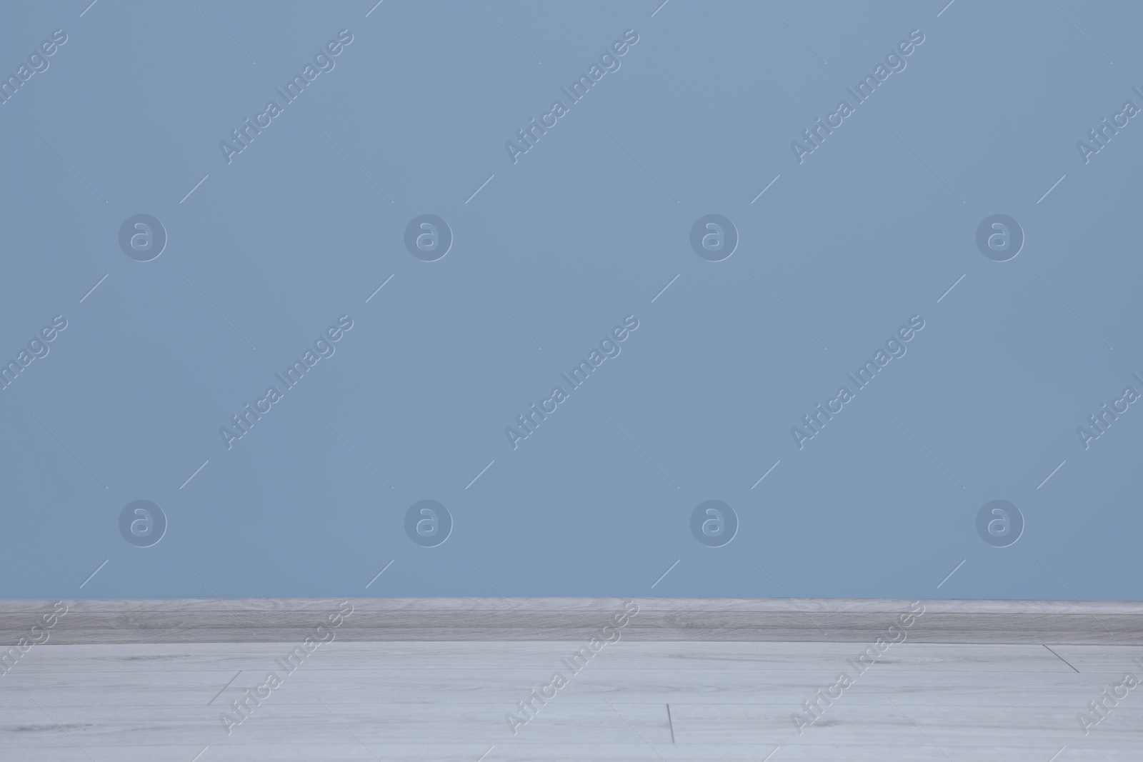 Photo of Beautiful light blue wall in clean empty room