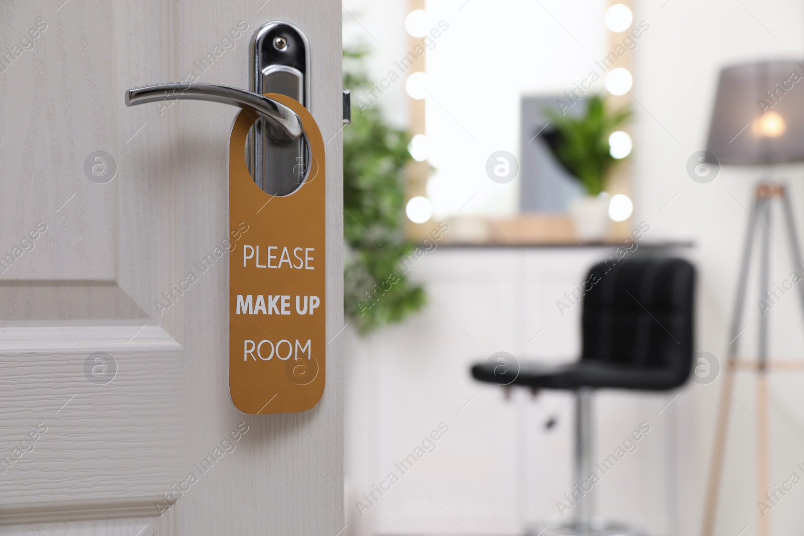 Photo of Open door with sign PLEASE MAKE UP ROOM on handle at hotel, space for text