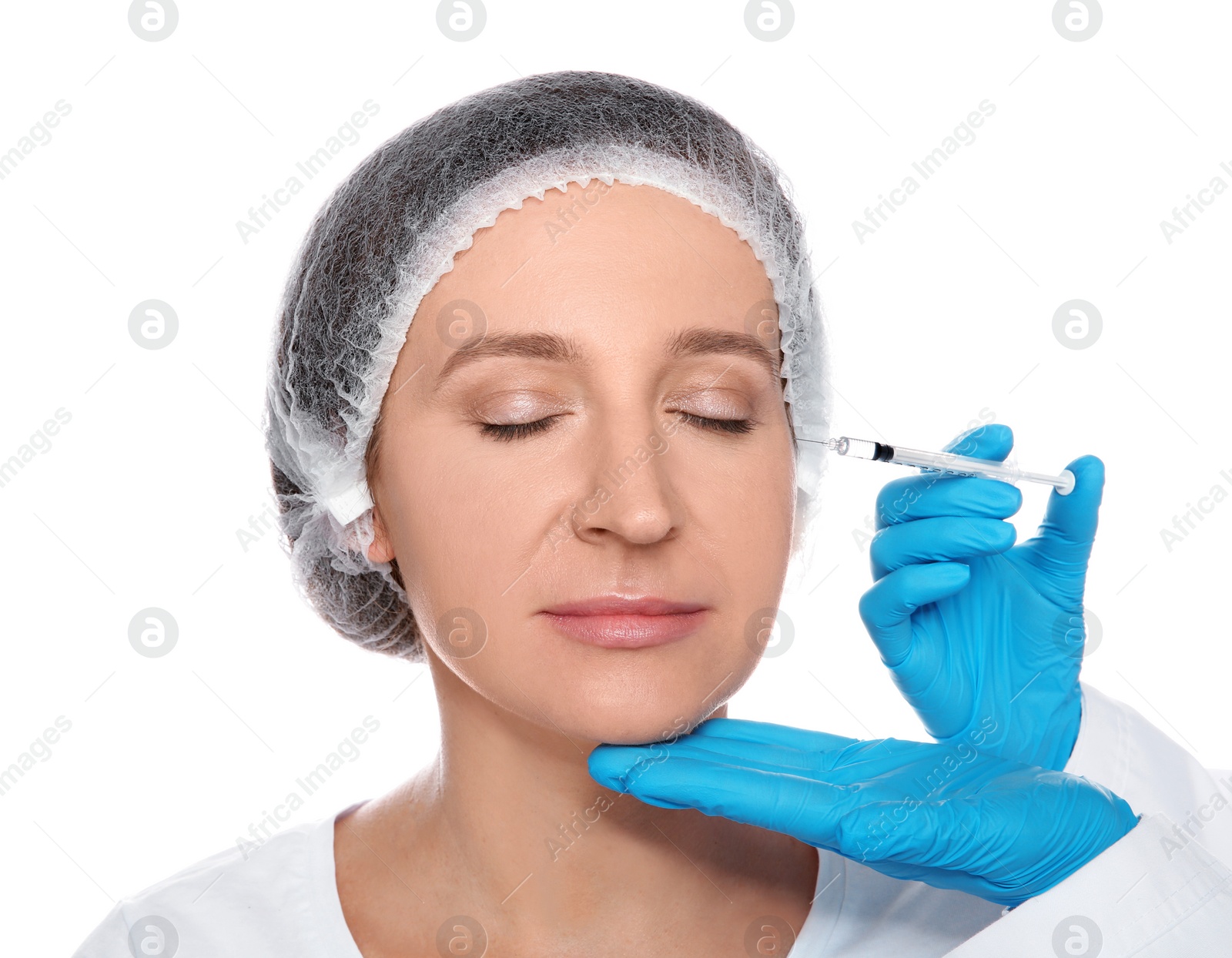 Photo of Mature woman getting facial injection on white background. Cosmetic surgery concept