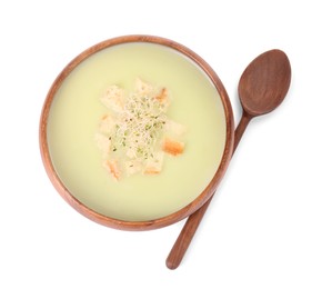 Photo of Bowl of tasty leek soup with croutons and spoon isolated on white, top view