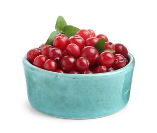 Photo of Bowl of fresh ripe cranberries with leaves isolated on white