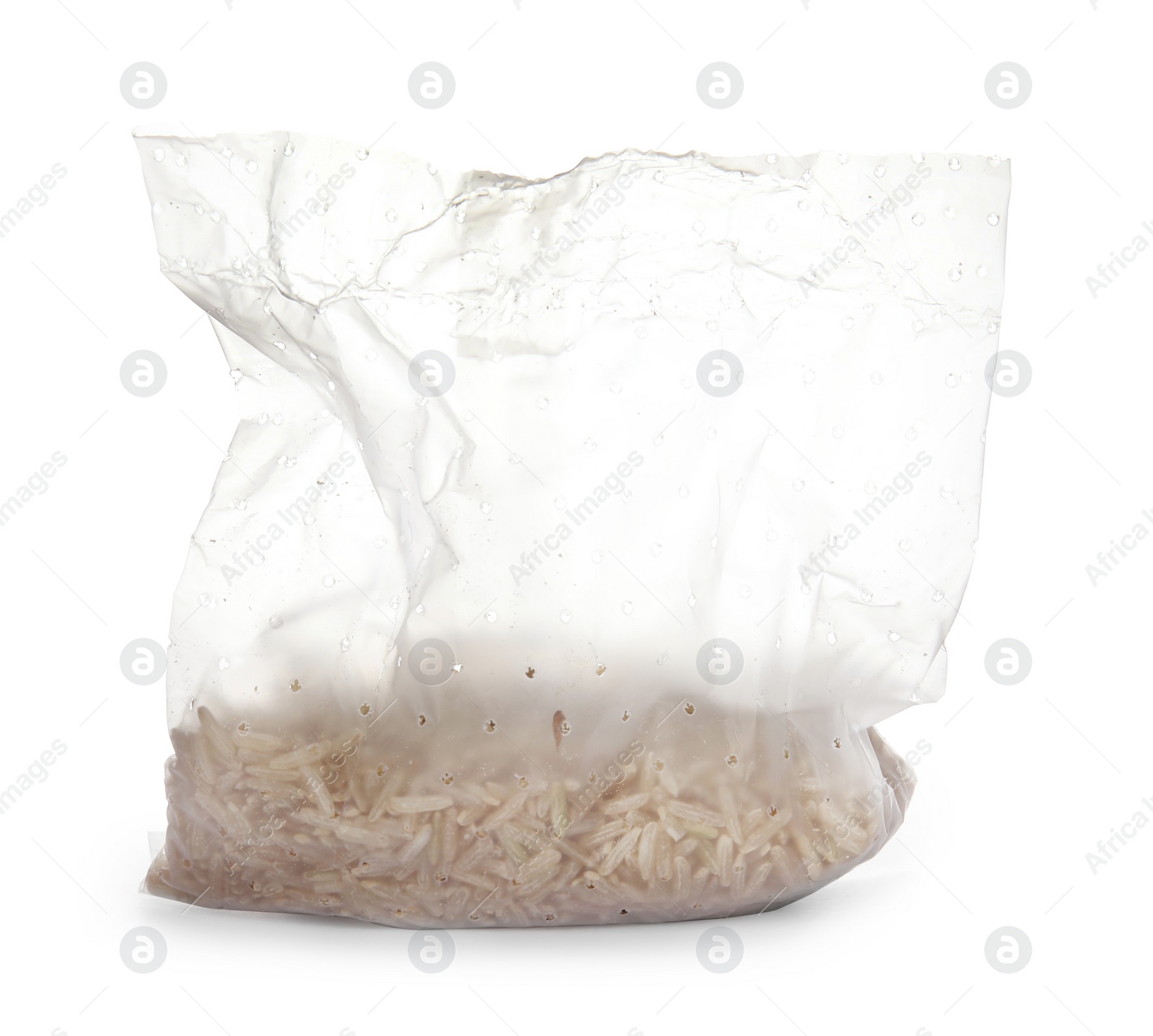 Photo of Plastic bag with raw unpolished rice on white background