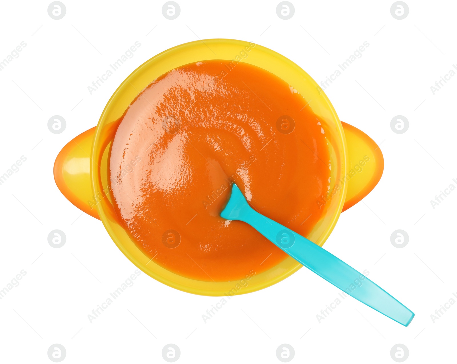 Photo of Delicious baby food and spoon in bowl isolated on white, top view