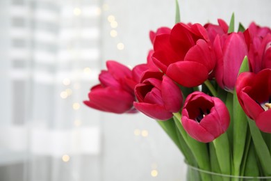 Photo of Bouquet of beautiful tulips indoors, closeup view. Space for text