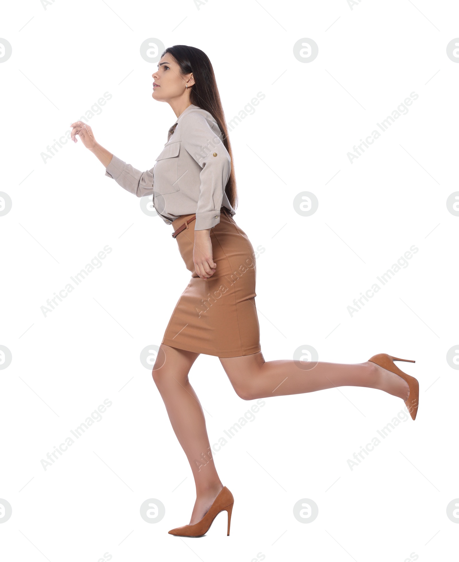 Photo of Beautiful young businesswoman running on white background