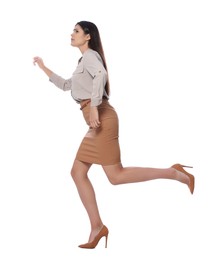 Photo of Beautiful young businesswoman running on white background
