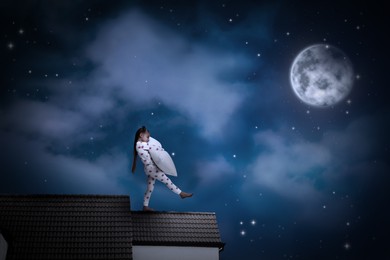 Girl hugging pillow and sleepwalking on roof under starry sky with full moon