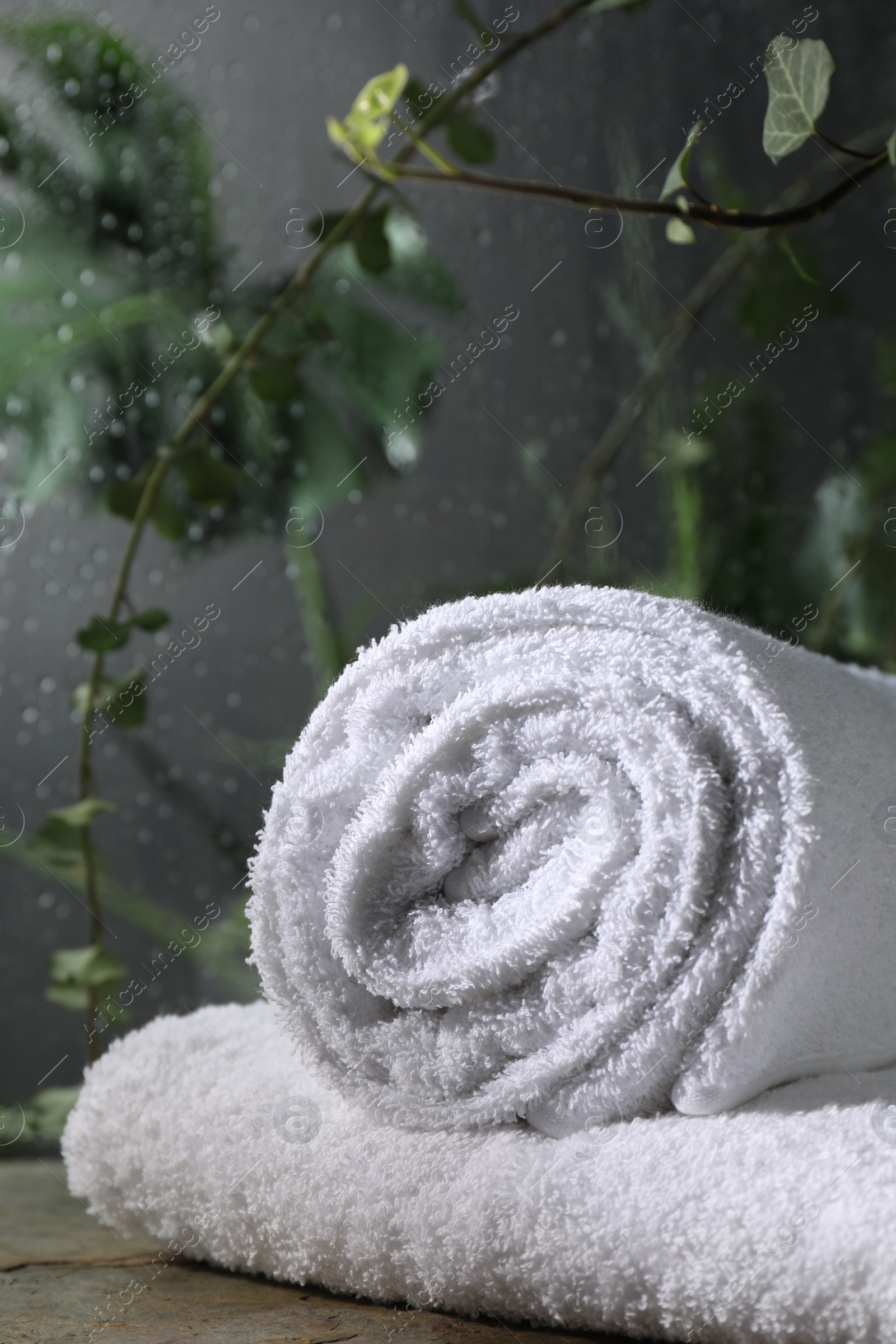 Photo of White terry towels on table in bathroom