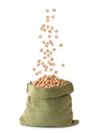 Image of Raw chickpeas falling into bag on white background