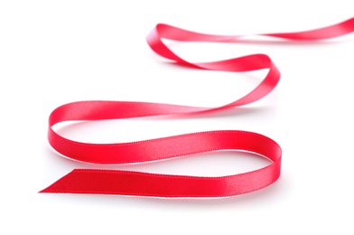 Simple pink ribbon on white background. Festive decoration