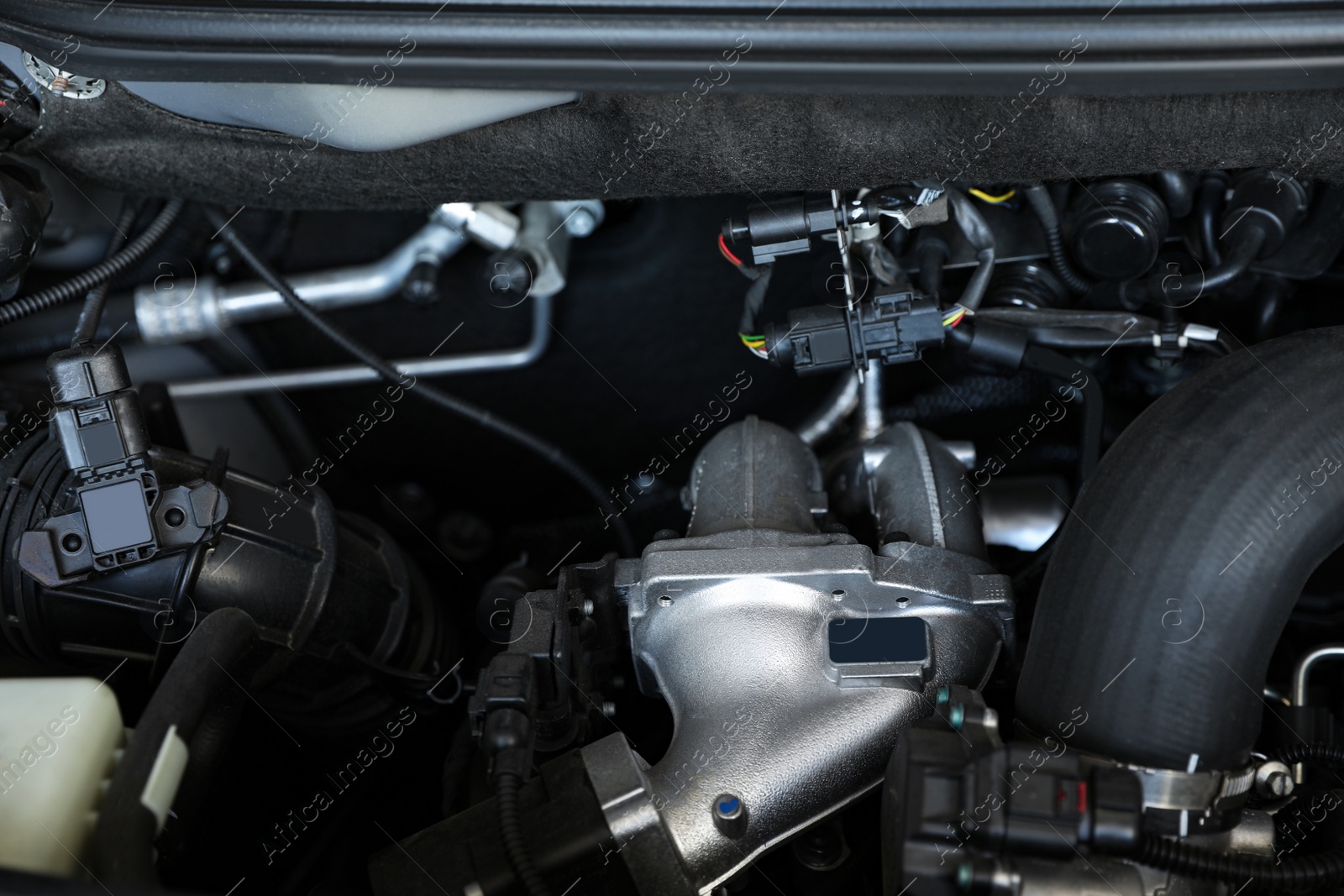 Photo of Closeup view of engine bay in modern auto