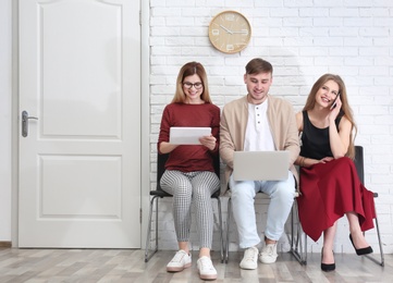 Group of people waiting for job interview, indoors