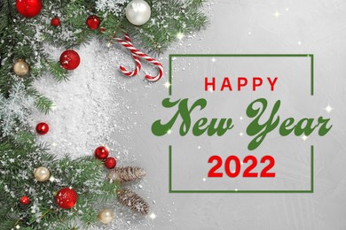 Image of Happy New 2022 Year! Festive decoration with white snow on light grey stone background, flat lay 