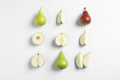 Ripe juicy pears on white background, top view