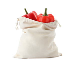 Photo of Cotton eco bag with bell peppers isolated on white
