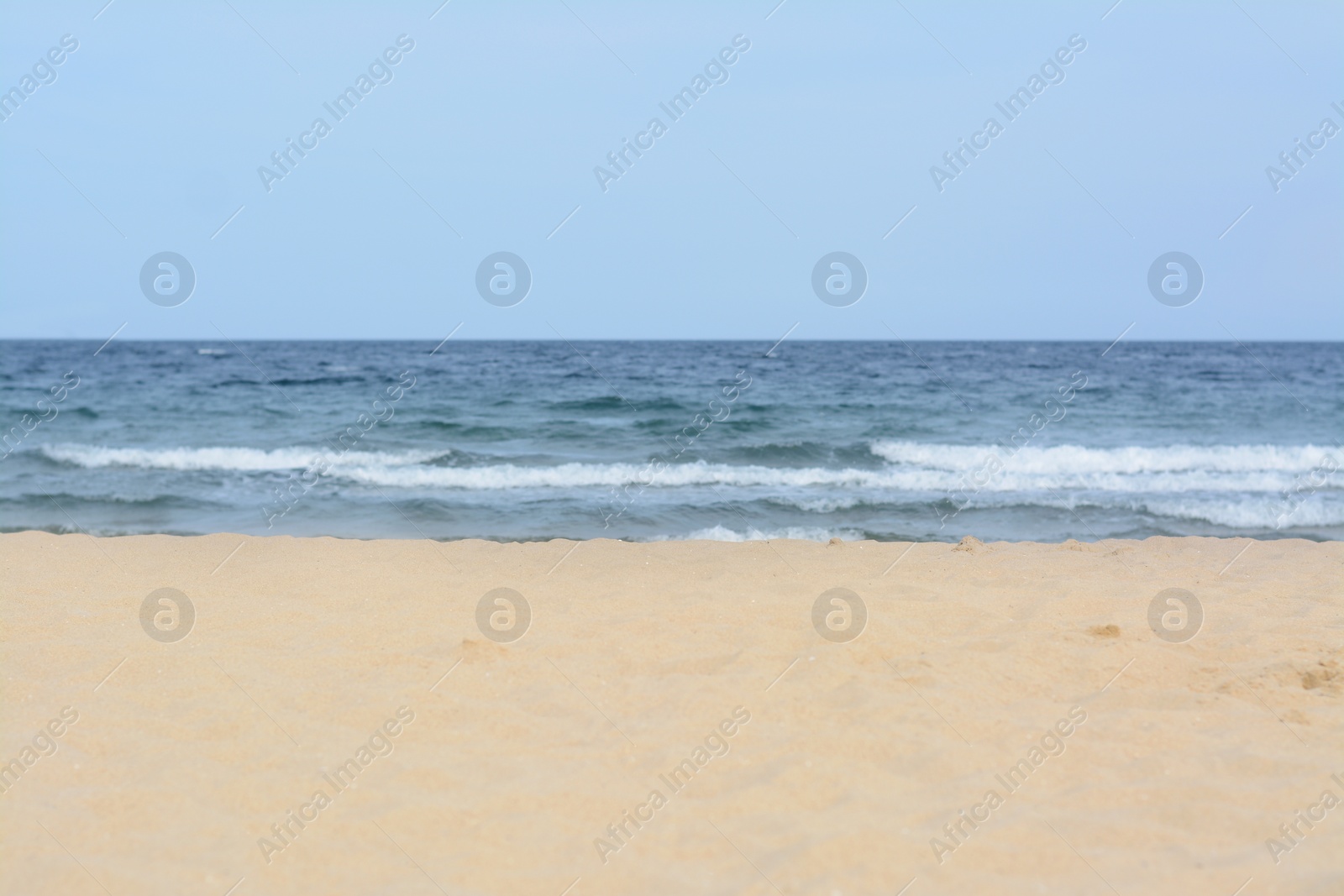 Photo of Beautiful view of sea with waves and sandy beach