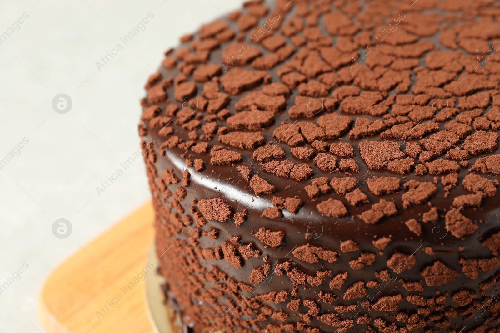 Photo of Delicious chocolate truffle cake on table, closeup