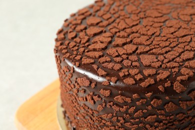 Photo of Delicious chocolate truffle cake on table, closeup