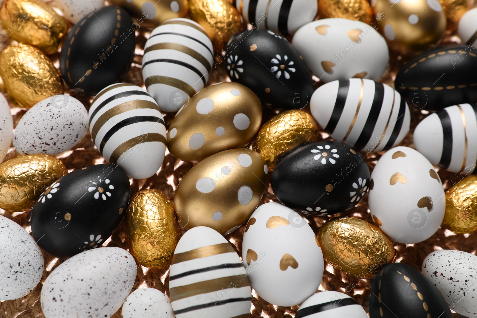 Photo of Many festively decorated Easter eggs as background