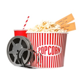 Photo of Popcorn bucket, tickets and reel isolated on white. Cinema snack